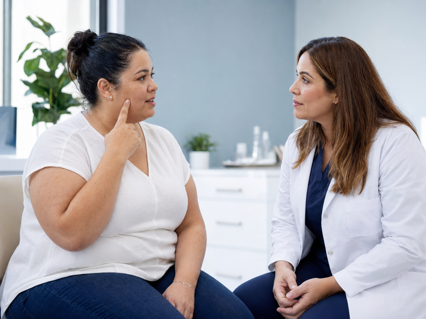 Weight-loss clinician discussing facial changes with a patient